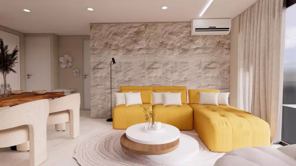 Yellow sofa against the stone feature wall